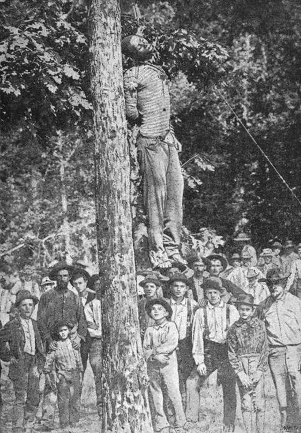 White children and parents gathered around a hanged Black man|Newspaper clipping|Colored Map of Little River County (Public Domain)|Lynching Memorial