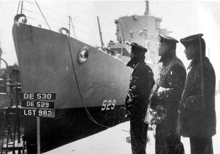 Crew Members Beside the USS Mason in Boston Harbor